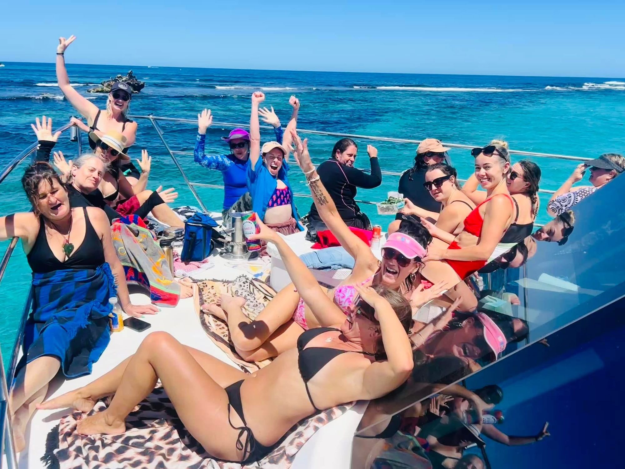 Ladies celebrating on the boat deck in Ningaloo