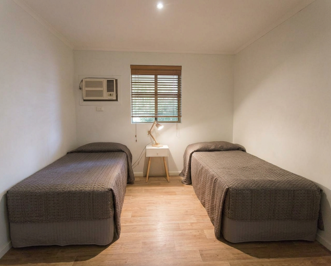 Two single beds in the shared twin room